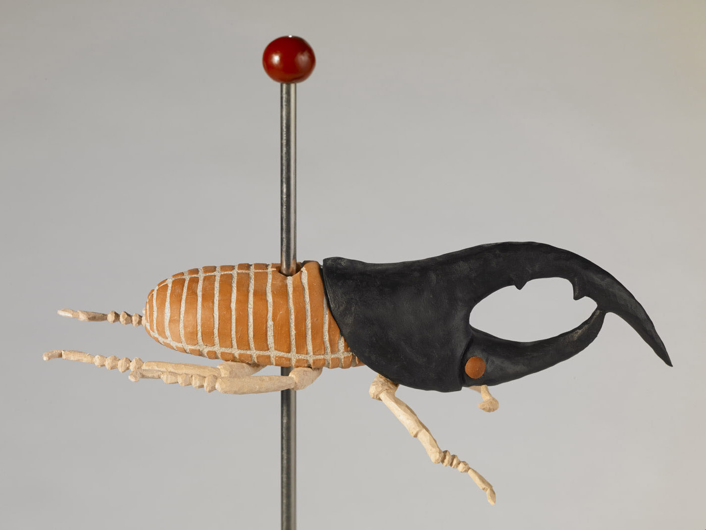 “Black Rhino”, clay, mortar, paint, carved wood, steel rod, cement, height with base
33 ¼”, bug 8” ht. X 15” length
